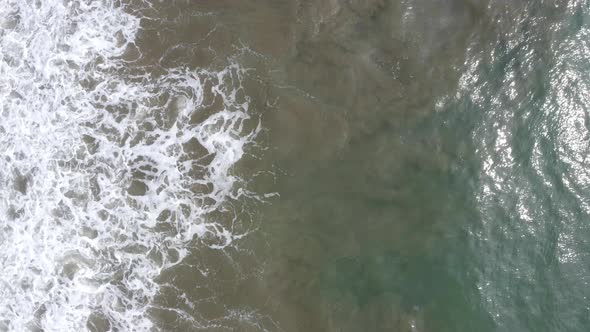 Aerial top down view of shimmering waves  alt
