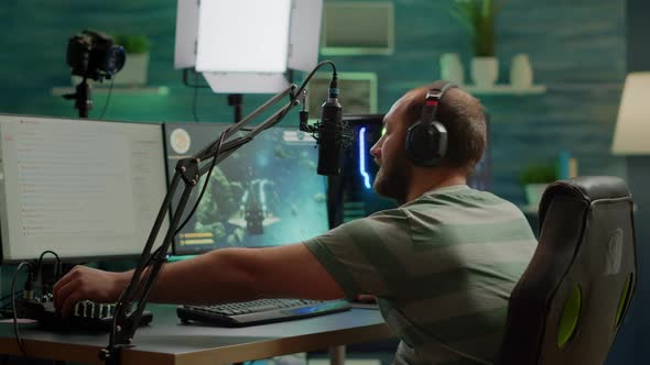 Excited Streamer with Headphones Winning Important Online Esport Competition alt