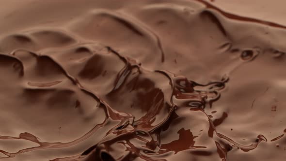 Super Slow Motion Shot of Waving Melted Chocolate at 1000 Fps alt