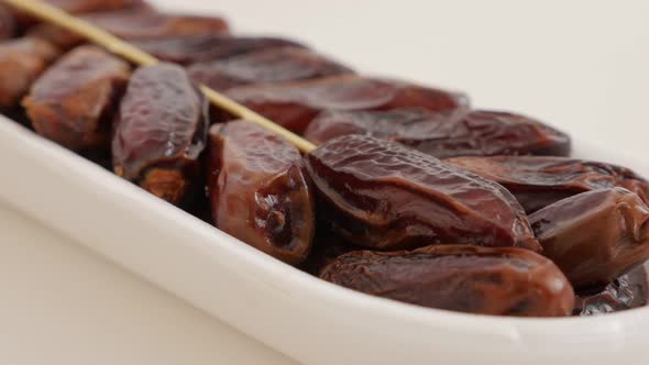 Phoenix dactylifera exotic fruit packed on white background  4K 2160p UltraHD footage - Date palm fr alt