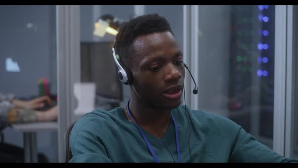 Young Man Working in Data Center alt