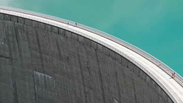 People Walking on Dam in Kaprun Reservoir Mooserboden Stausee, Austria alt