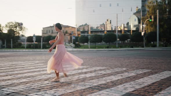 Professional Ballet Dancer Jumps and Spins on Crosswalk alt