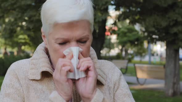 Allergic Middleaged Lady Feels Unwell Having Flu Symptom Ill Old Mature Woman Hold Tissue Sneezing alt