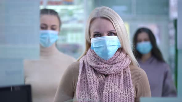 Front View Satisfied Woman Taking Pills Leaving As Next Client Approaching to Cashdesk in Pharmacy alt