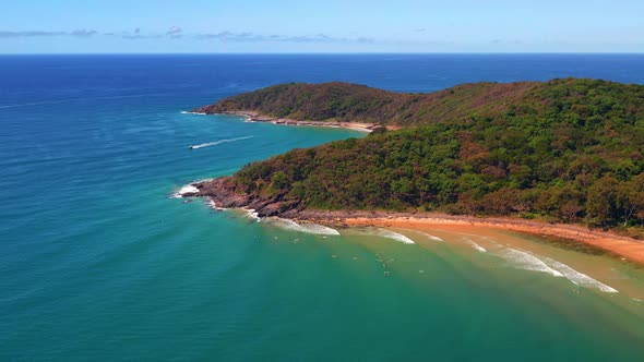 Panoramic View Of Noosa National Park With Several Surfers In Turquoise Beach Near Noosa Heads In QL alt