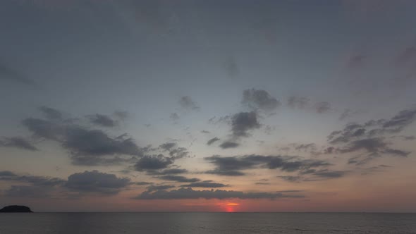Time Lapse The Sun Going Down To The Sea Clouds Moving Above The Ocean. alt