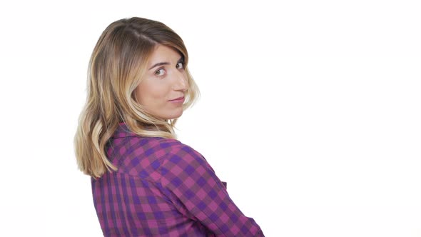 Portrait From Back of Charming Woman 30s with Dyed Blond Hair Turning Around on Camera with alt