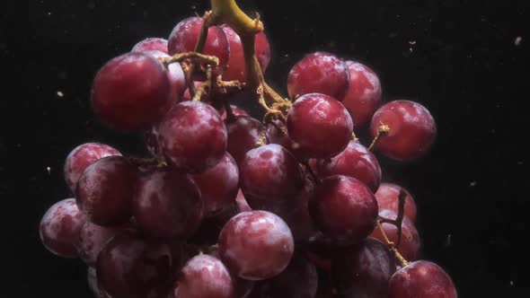 Slow Motion of Red Grapes in Water