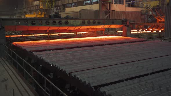 Steel Mill Steel Bars and Pipe Production Redhot Pipes Transported on Production Line Heavy Industry alt