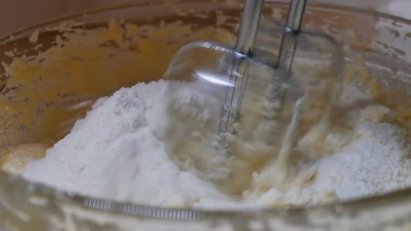 Immerse the Beaters of the Mixer Into the Dough and Start Mixing with Flour By Turning on the Mixer