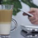 A Cup Of Coffee On The Background Of A Working Businessman - VideoHive Item for Sale