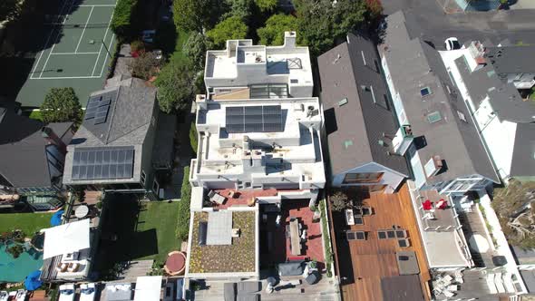 Tilt up aerial reveal of luxury homes along Malibu Beach, California alt