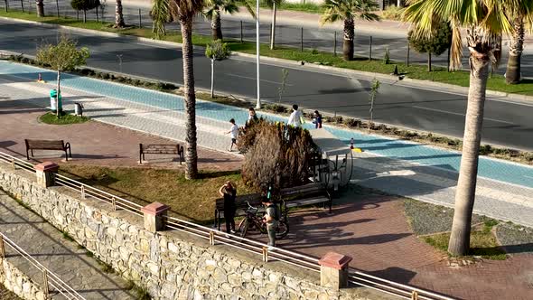 People walk around the embankment 4 K alt