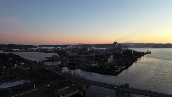 Silhouette with smoke from industrial island Heroya in Porsgrunn operated by Yara and Hydro - Late e alt