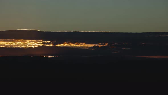 Golden Sunrise Behind Thin Layer of Clouds Timelapse Wide Shot