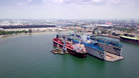 Aerial View of Logistics Concept a Cargo Ship Being Retrofit alt