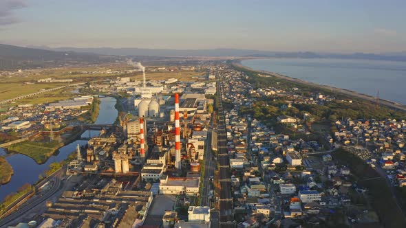 Aerial view of petrochemical oil refinery and sea in industrial engineering in Shizuoka, Japan. alt