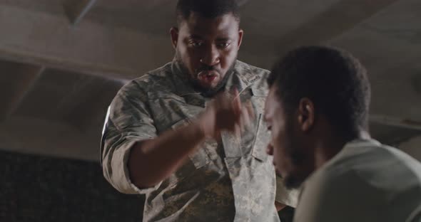 African American Commander Scolding Soldier alt