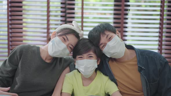 happiness asian dad mom son wearing face mask sit relax smile together healthy asian family