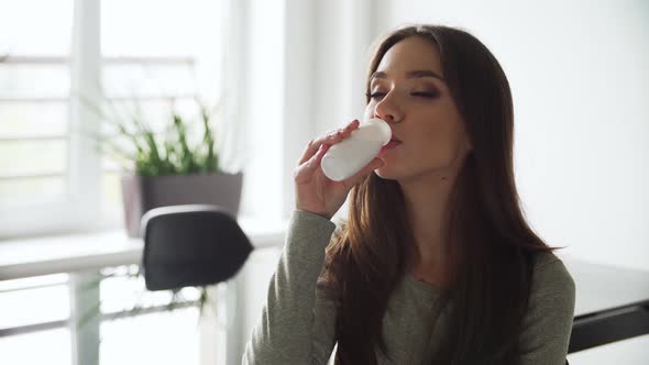 Healthy Drink. Beautiful Woman Drinking Natural Yogurt alt