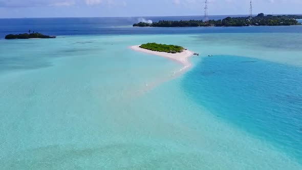 Aerial travel of island beach break by blue sea with sand background alt