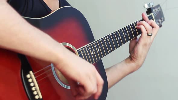 Man Playing An Acoustic Guitar alt