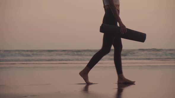 Female Legs Walking by Ocean Shore alt