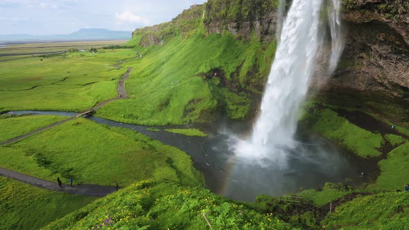 Seljalandsfoss Waterfall in Iceland with a Rainbow alt