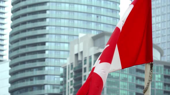 Canada Flag Waving in Front of Building