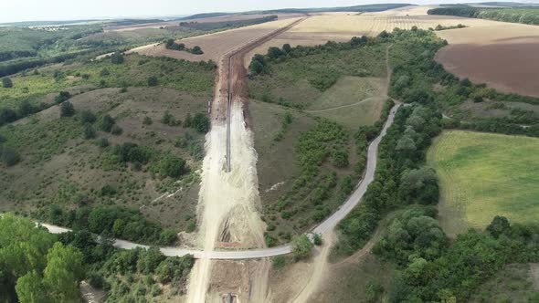 Aerial view of gas and oil pipeline construction. Pipes welded together alt
