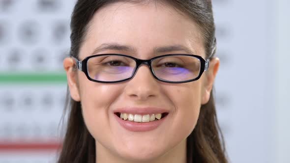 Woman in Eyeglasses Smiling at Camera, Ophthalmological Problems Treatment alt