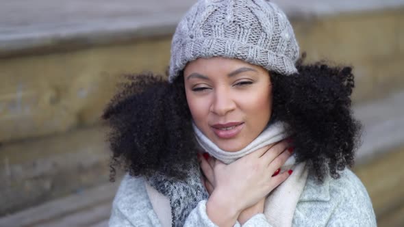 Young African American Woman is Posing in Good Mood While Standing Outdoors Spbi alt