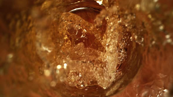 Fresh Beer Pouring into Glass as Macro Super Slow Motion Top Shot