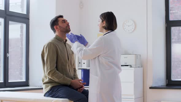 Doctor Checking Lymph Nodes of Patient at Hospital