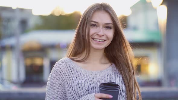 Smiling Young Woman Walking at The Street