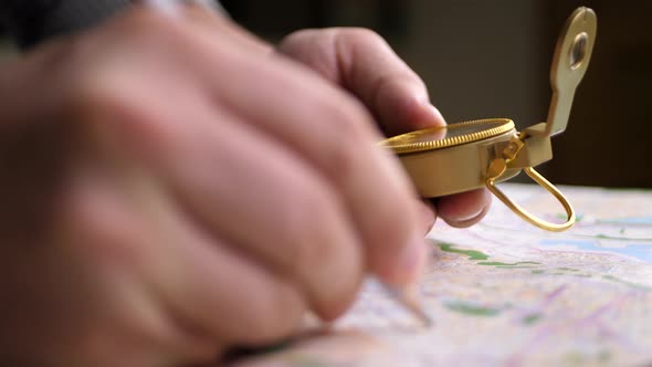 Travel Destination Points on Map with Compass in Hand on Background of Map