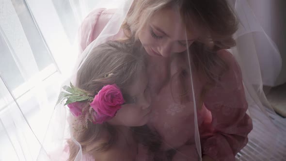 Portrait Beautiful Family Mother and Daughter in Pink Dresses and Grid on Head alt