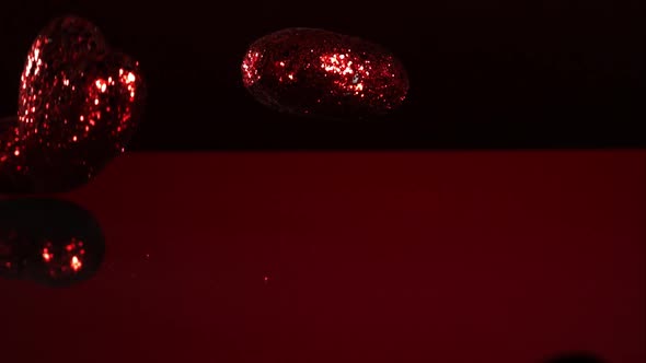 Decorations falling, bouncing in ultra slow mo  alt