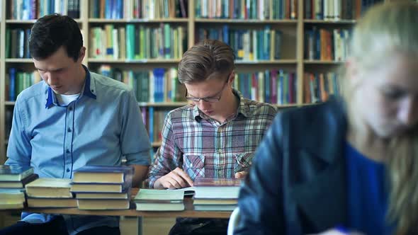 A Group of Students Study in the Library alt