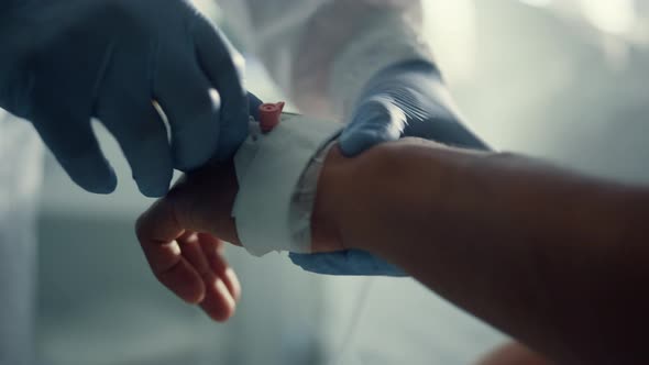 Patient Hand with Iv Catheter Closeup alt