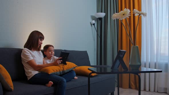 Happy Family  Woman Her Little Son Sitting Couch Looking Photographs alt