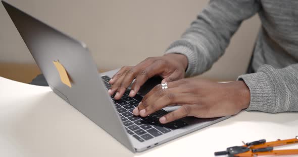 Image of African American Businessman Working on His Laptop alt