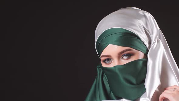 Portrait of an Attractive Young Modern Muslim Woman in Hijab alt