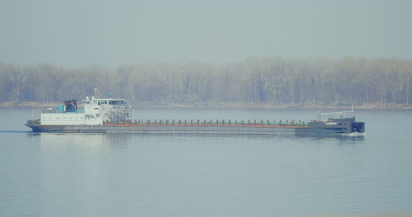Cargo Barge Floats on the River alt