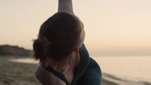 Sporty Woman Performing Utthita Trikonasana on Beach Summer Morning Close Up alt