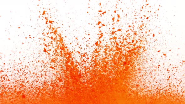 Super Slow Motion Shot of Orange Powder Explosion Isolated on White Background at 1000Fps alt