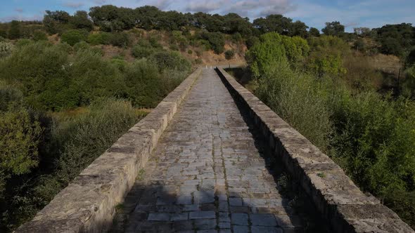 Low altitude aerial fpv along Roman bridge at Vila Formosa In Portugal alt