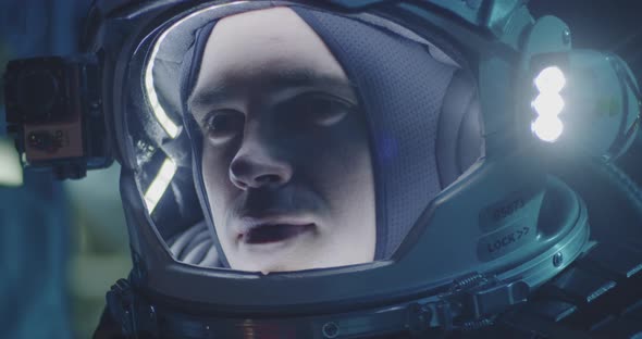 Astronaut and Scientists Testing Spacesuit alt