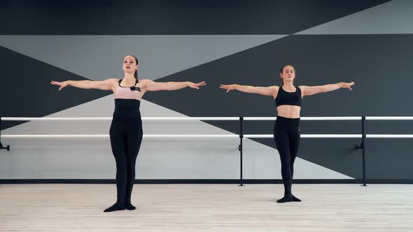 Synchronized Female Instructor and Girl in Learning Moves alt